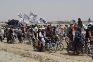 [1200x800] Supporters of the Taliban carry the Taliban's signature white flags in the Afghan-Pakistan border town of Chaman, Pakistan, Wednesday, July 14, 2021. (Tariq Achakzai/AP)