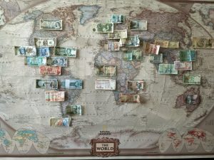 Old map with old money from around the world
