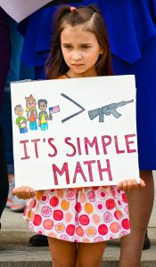 A child protesting gun violence