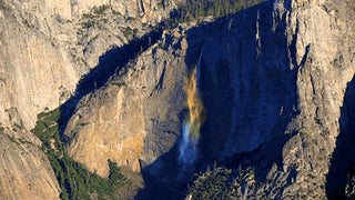 High winds at the perfect time of day created a previously undocumented 2,400 foot rainbow waterfall in Yosemite National Park