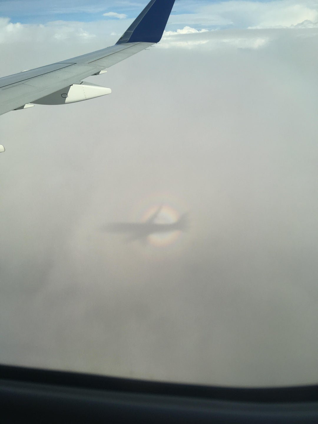 This shadow a plane cast on the clouds