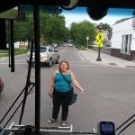 Lady won't let bus drive away after getting kicked off, breaks the bus window, cries, then runs off.
