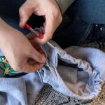 Using a mechanic’s tool to re-thread a hoodie