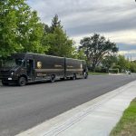 These 2 UPS trucks trading packages