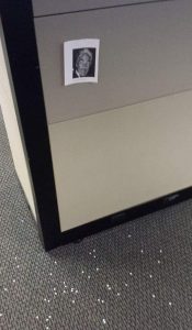 Someone spilled hole-punch confetti by my cubicle. I tacked up a pic of Rip Taylor.