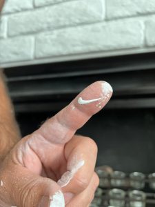The paint drip on my finger looks like a perfect little Nike swoosh.