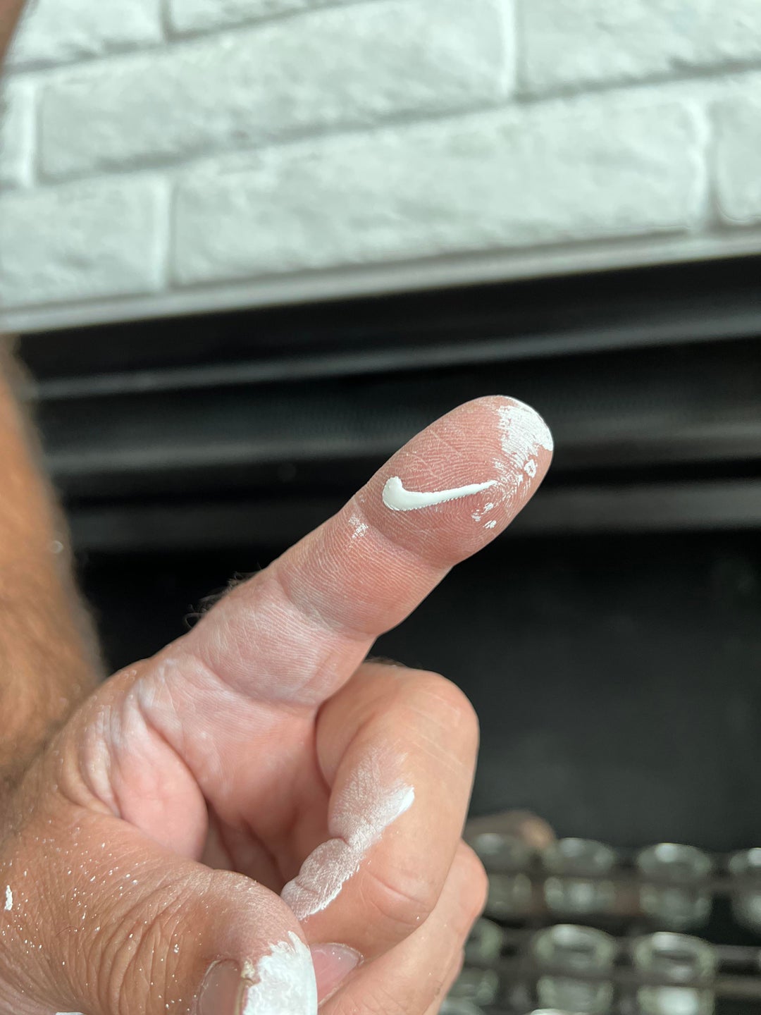 The paint drip on my finger looks like a perfect little Nike swoosh.