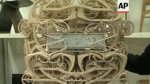 This mechanical clock made of wood by a Japanese student writes the time every minute.