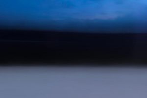 Photo taken from a moving train in Estonia during the winter.