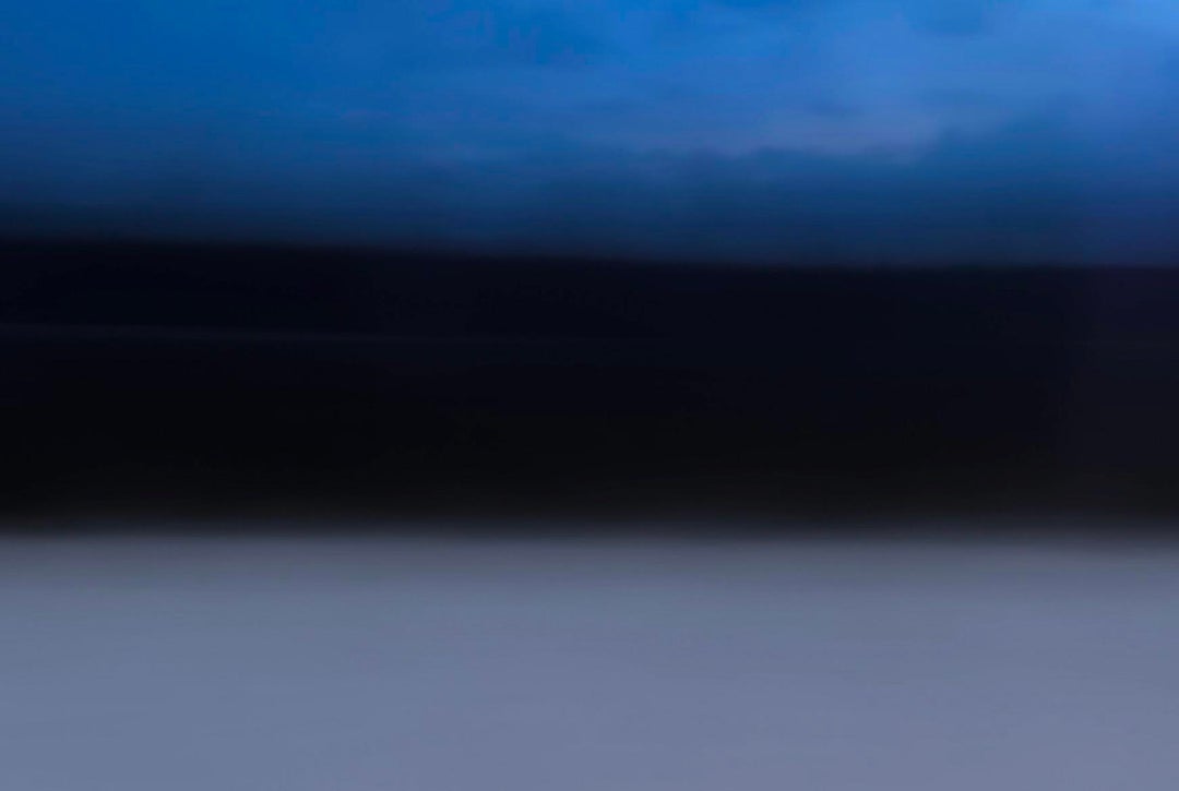 Photo taken from a moving train in Estonia during the winter.