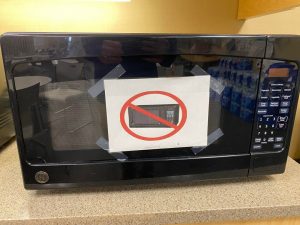 This sign popped up on a microwave at work. Not sure how to interpret