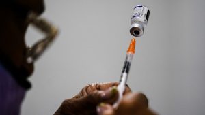 Pfizer says its tweaked COVID-19 shots boost omicron protection