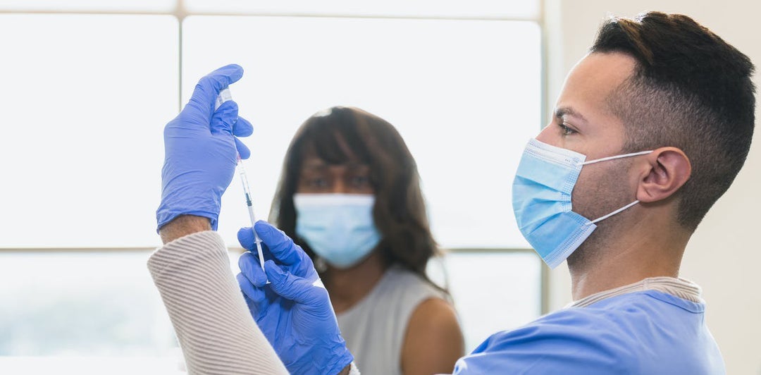 Should you get a COVID-19 booster shot now or wait until fall? Two immunologists help weigh the options