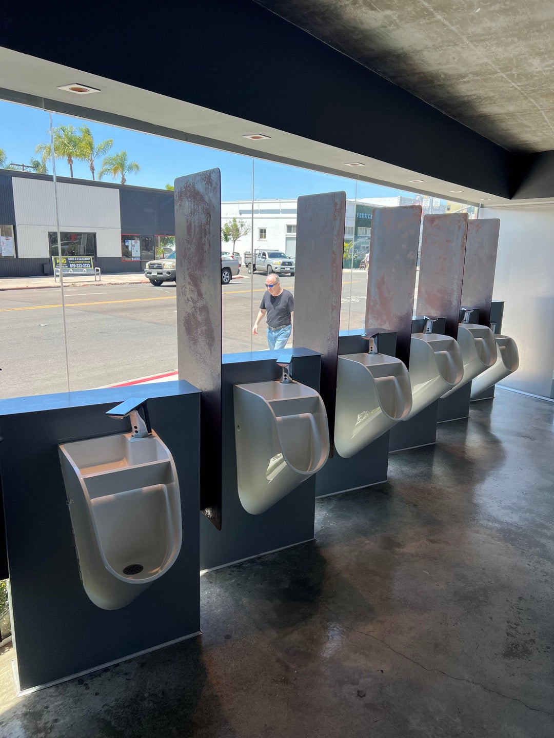 These urinals where you can look out to the street. Windows aren’t tinted at all so you can also see in. Even has a sink on top of each one.