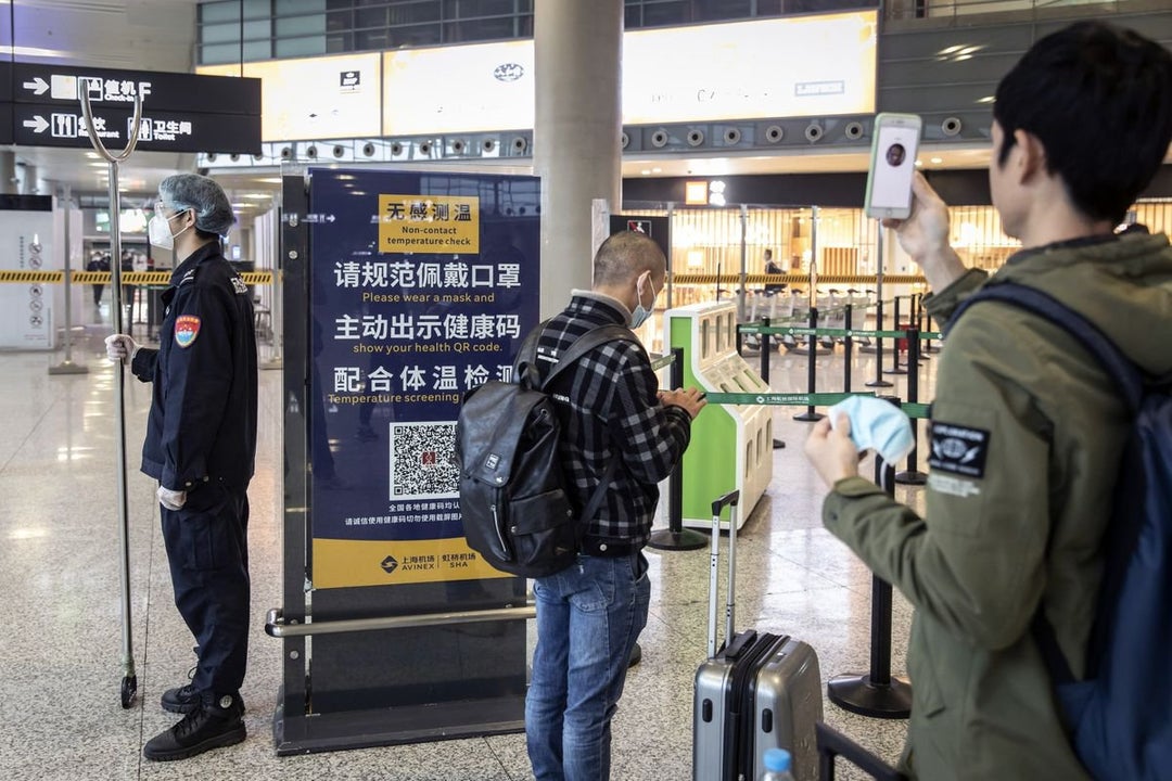 China Cuts Quarantine in Half for Travelers and Close Contacts