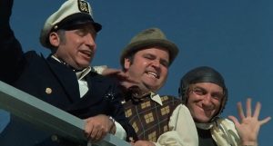 Mel Brooks, Dom DeLuise and Marty Feldman race a wheelchair bound Paul Newman in a chase scene from the 1976 satirical comedy "Silent Movie".