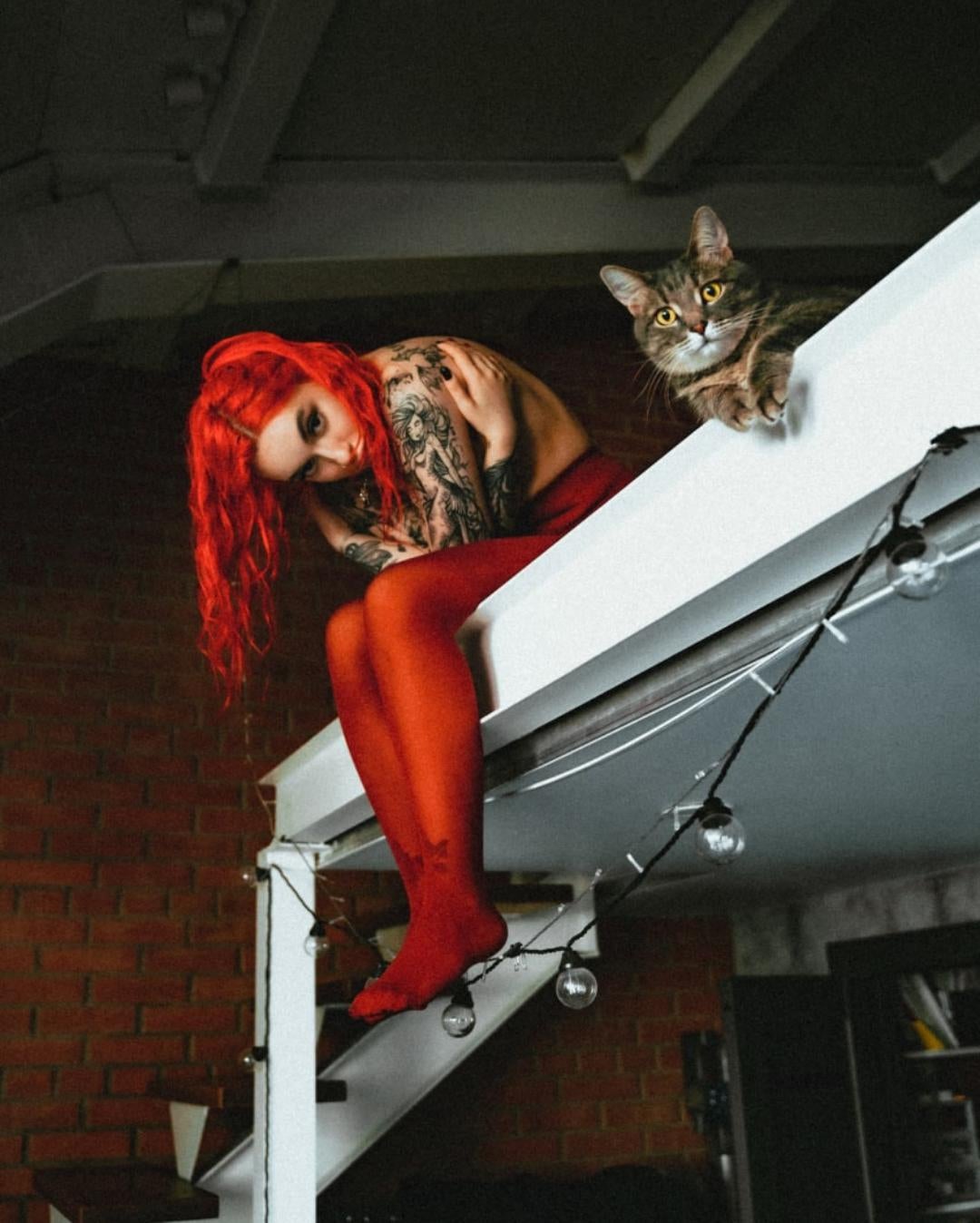 Took a photo of my friend and her cat. I don't even know which one is more photogenic