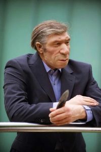This is what a Neanderthal would look like with a modern haircut and a suit.