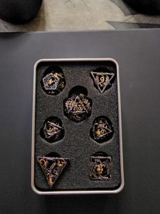 Not sure if this is allowed here, but I got my new dice in. It's my first metal set. They're so pretty!