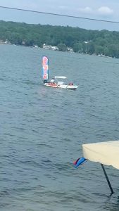 An ice cream boat that stops by the docks of people who live on the lake