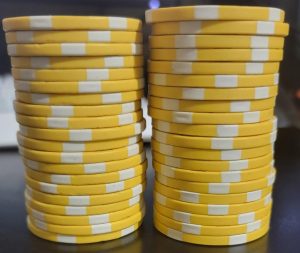 A stack of 20 heavily used poker chip become one chip shorter than a same size stack of unused chip from the same batch