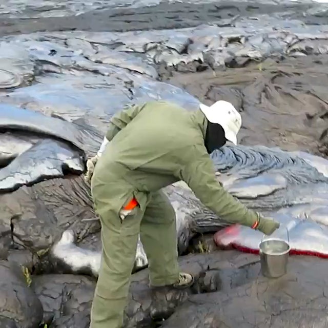 This is how geologists collect lava samples from an active volcano