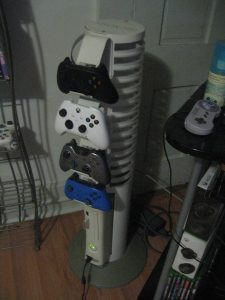 My OG Xbox 360 in its Vertical Stand still in my living room in July 2022