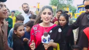 Pakistani news correspondent slaps a boy on live TV for interfering with her report!