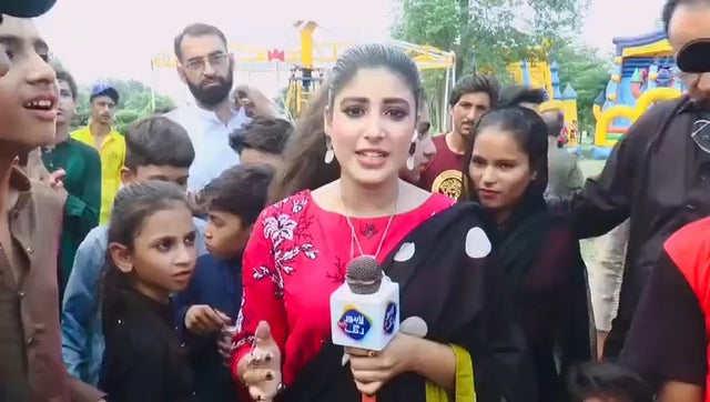 Pakistani news correspondent slaps a boy on live TV for interfering with her report!