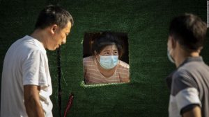 Shanghai fears new lockdown as millions test for Covid amid sweltering heat