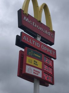 Big Mac and Happy Meal prices displayed on the roadside at McDonalds in Sweden