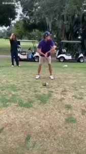 This guy has a unique golf swing.