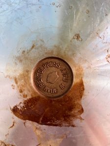 They messed up the lettering when casting these frying pans