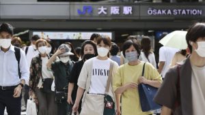 Japan's daily COVID cases top 150,000, new record high