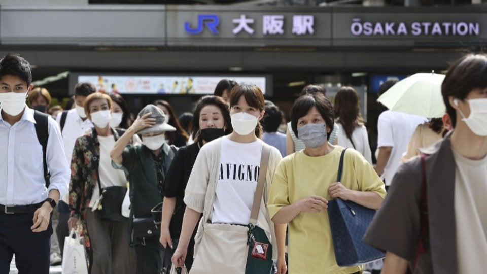 Japan's daily COVID cases top 150,000, new record high