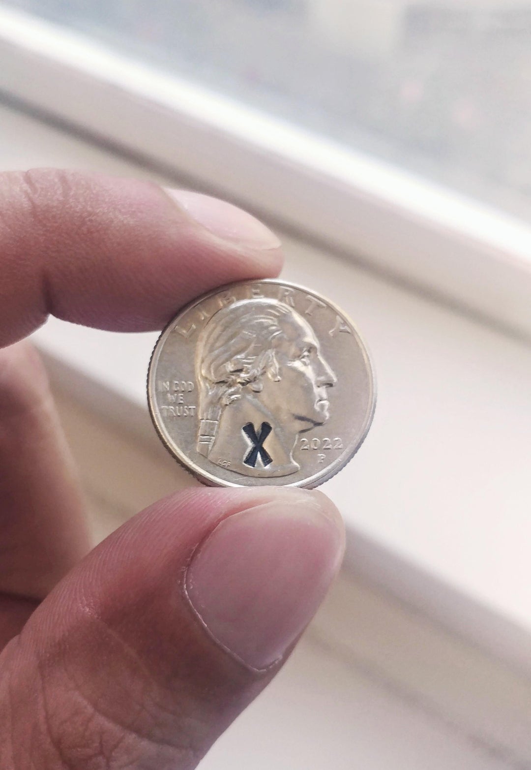 Found this quarter with an 'X' stamped on it