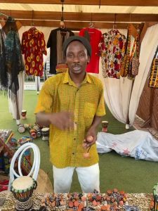 Ghanaian musician Moussa Diarra demonstrating how to play the kush-kosh